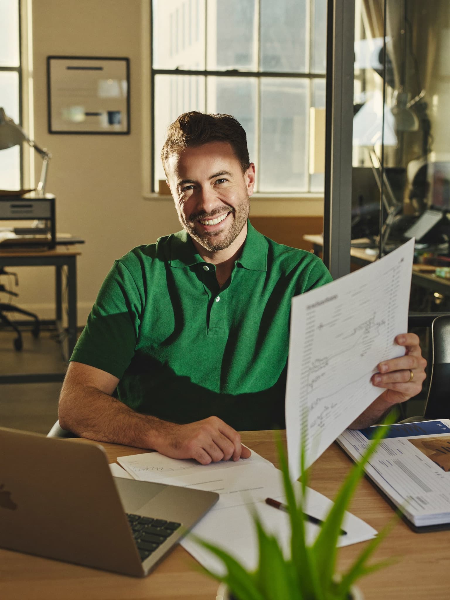 A UK business owner reviewing payroll savings